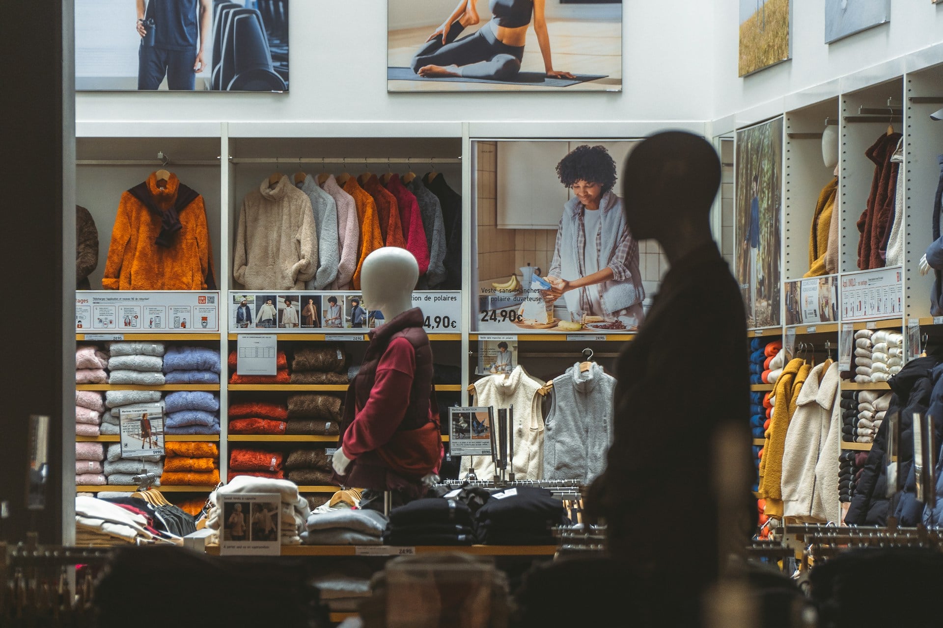 Modern fashion retail store with clothing displays and in-store shopping environment